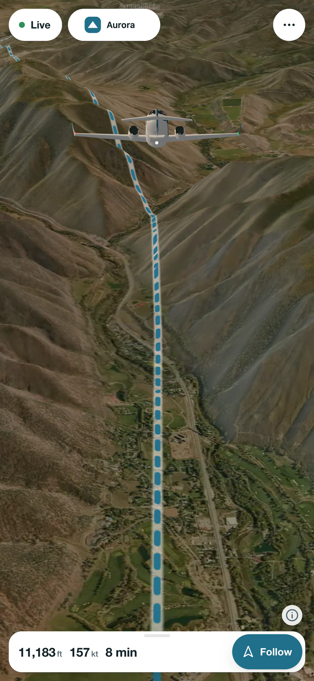 Owl View on a phone: the follow view behind the jet, descending the Roaring Fork valley toward Aspen
