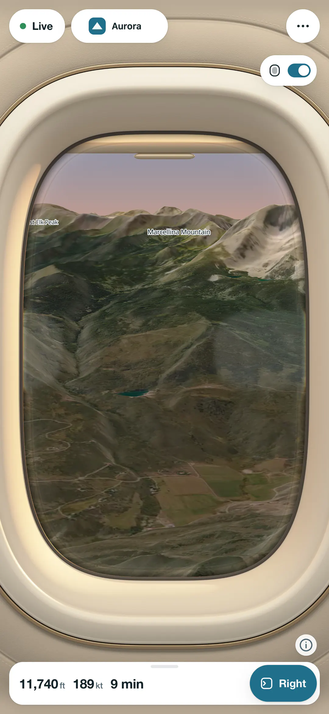 Owl View, our moving map, on a phone: the right window view on the approach into Aspen at golden hour, framed by a cabin window