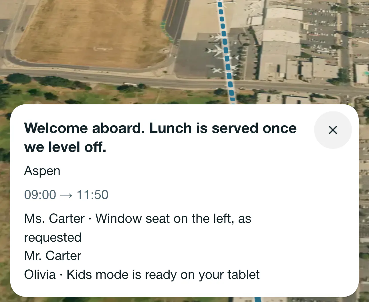The welcome card at Van Nuys before departure, over the runway: “Welcome aboard. Lunch is served once we level off.”, the destination, the schedule and three passengers with their notes
